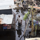 A resident of Loiza, Puerto Rico, wades through flood water days after Hurricane Maria made landfall, on Sept. 22, 2017. (Alex Wroblewski/Getty Images)